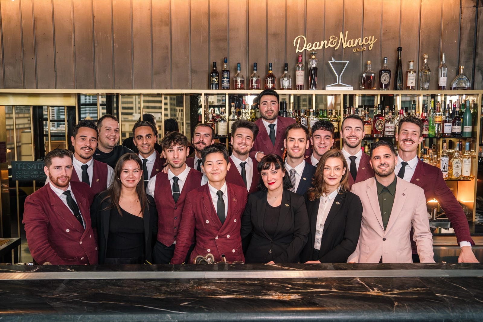 The full Dean & Nancy team gathered together behind the bar